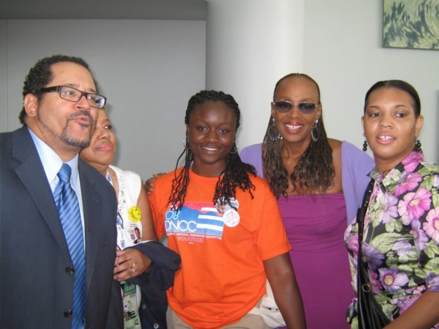 Sajdah with a group of four people at an indoor 2008 DNC event