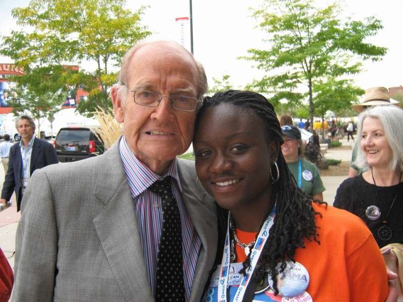 Sajdah smiling next to former Senator George McGovern outdoors at the 2008 DNC